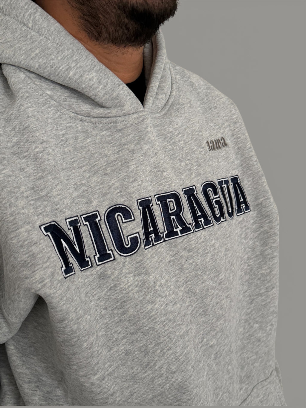 Gray hoodie with 'Nicaragua' text on a gray background